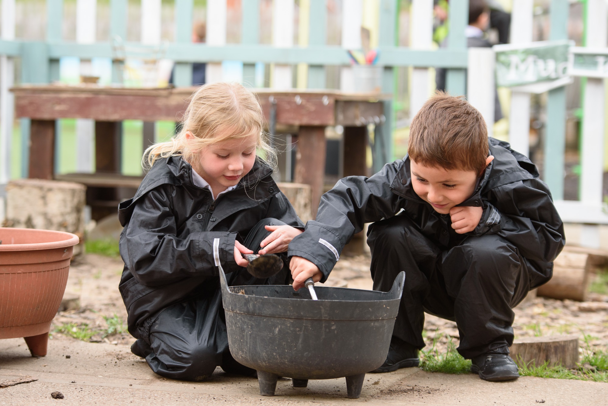 children in the mud kitchen